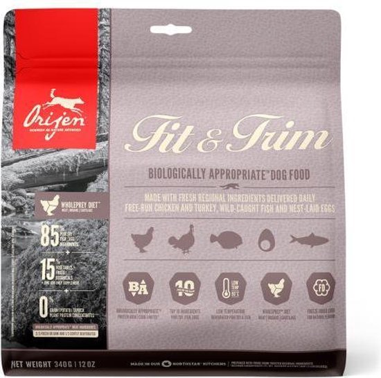 Orijen Fit & Trim hondenvoerzak met afbeelding van een bos en waterloop. De tekst vermeldt "WHOLEPREY DIET" en "85% meat, 15% fruit & veg".