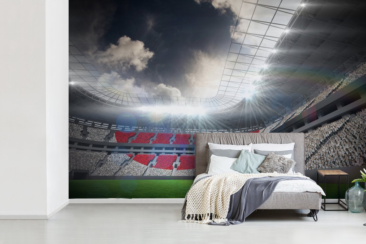 Behang - Fotobehang een voetbalstadion onder de wolken - Breedte 420 cm x hoogte 280 cm