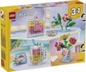 Boîte LEGO Creator 3in1 31383 montrant des exemples : flacon de parfum, vase de fleurs et tasse à boire. Dimensions 26.2 x 6.1 x 19.1 cm.