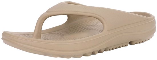 Beige slipper, diagonaal van opzij gezien.