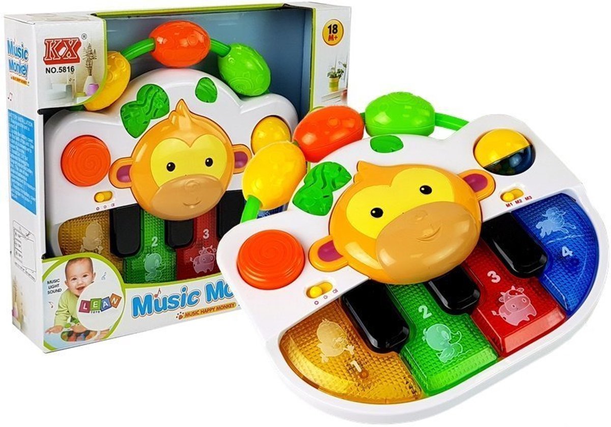 Een piano met een aap als baby. Geluid en licht