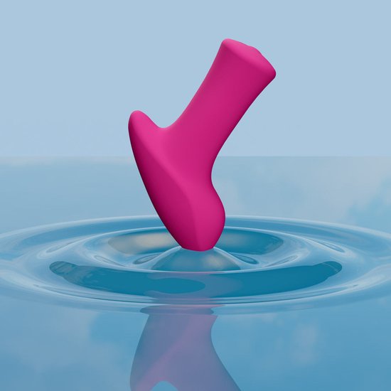Roze Ambi mini vibrator die opgaat in een waterrimpeling.
