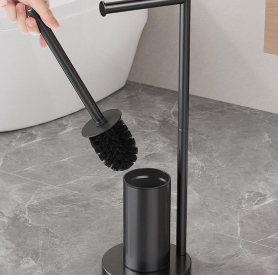 Zwarte toiletrolhouder met toiletborstel, een hand verwijdert de borstel.