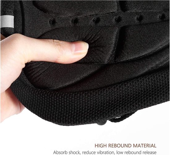 Vinger die op het zwarte, schokabsorberende zadelkussen van high-rebound materiaal drukt.