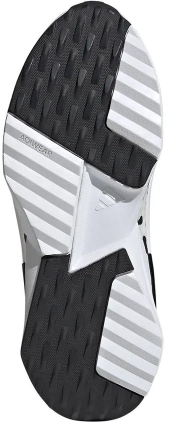 Semelle d'une chaussure de sport noire avec des détails blancs et le logo Adiwear.