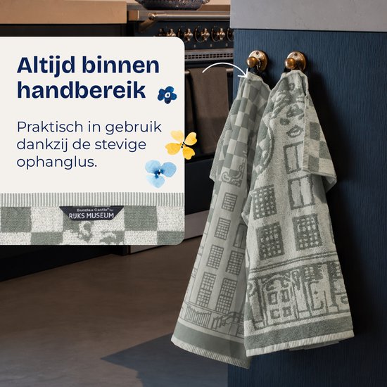 Deux torchons avec un motif de maison de canal et à carreaux, suspendus à des crochets dorés.