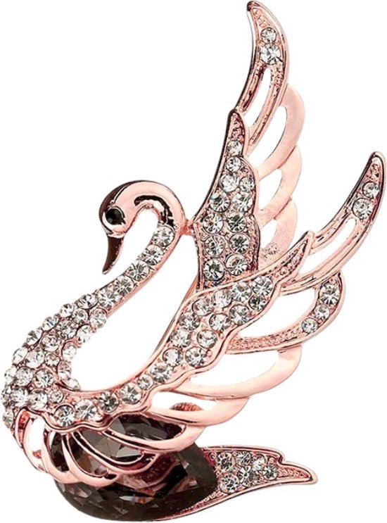 Broche dorée en forme de cygne, ornée de strass, avec une pierre foncée à la base.