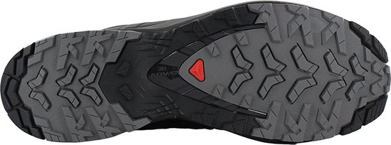 Zwarte buitenzool met grijs profiel en rood Salomon logo.