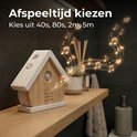 Houten vogelhuisje met muzieknoten en vogels die uit de speaker komen. Text 'Kies speeltijd'.