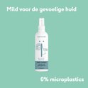 Naïf Haarlotion met een leeuwenillustratie en de tekst '0% microplastics'.
