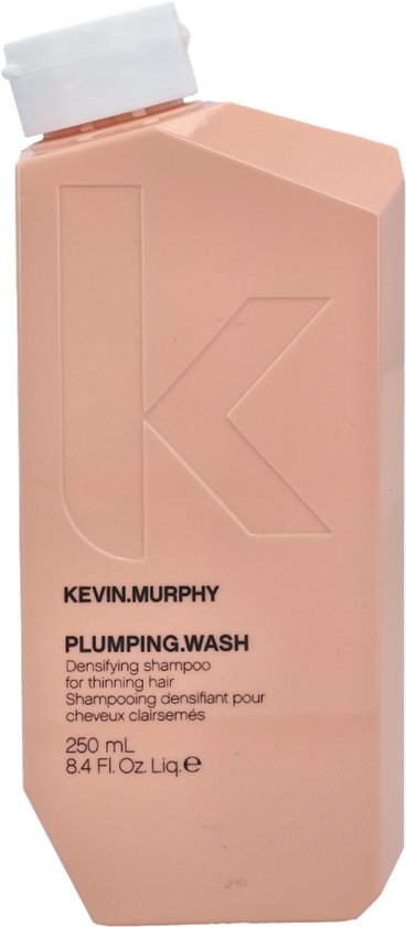 Perzikkleurige fles KEVIN.MURPHY PLUMPING.WASH shampoo met witte dop.