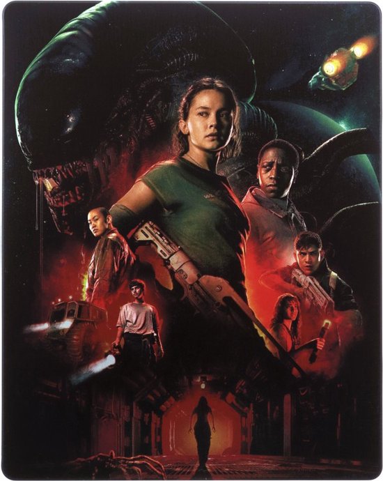 Pochette Blu-ray avec une femme en chemise verte tenant un fusil, entourée d'un groupe de personnes et d'un grand Xénomorphe.