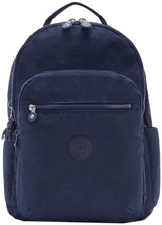 Sac à dos Kipling bleu foncé avec porte-clés singe gris, poche avant zippée et poches latérales.