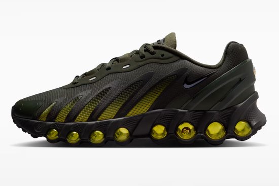 Donkergroene Nike Air Max sneaker met zwarte zool en gele 'bubbeltjes'-details.