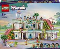 Boîte de LEGO Friends Centre Commercial avec 6 mini-poupées, un chariot à glaces et 2 toboggans. À partir de 8 ans.