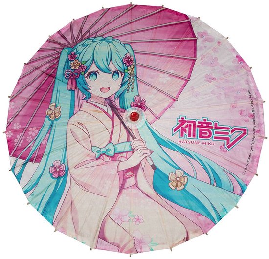 Parapluie rose avec une illustration d'anime de Hatsune Miku en kimono, avec des fleurs et du texte japonais.
