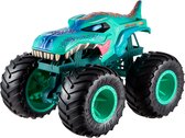 Groene monster truck met dinosaurusvorm, grote zwarte wielen en oranje en paarse details.