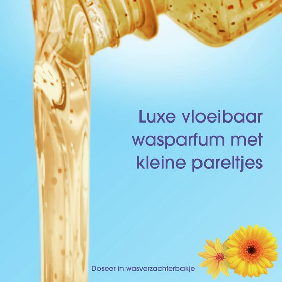 Luxe vloeibaar wasparfum met kleine pareltjes in een fles, met gele bloemen.