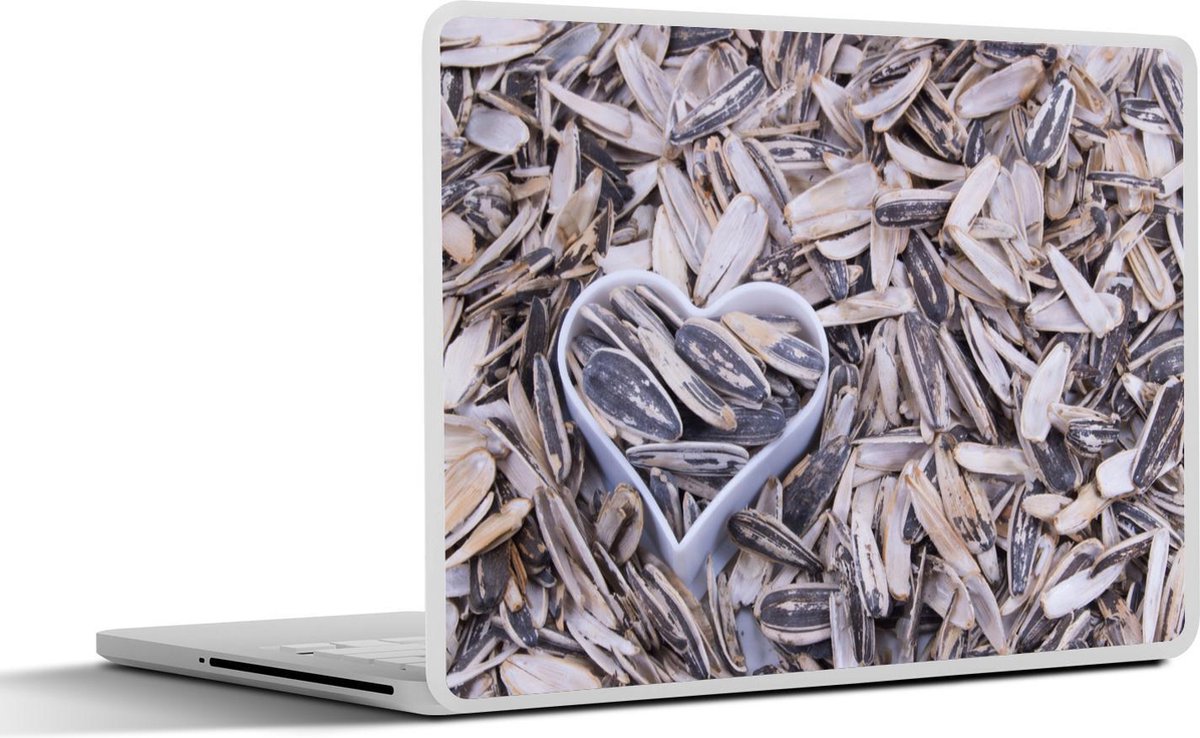 Afbeelding van product SleevesAndCases  Laptop sticker - 15.6 inch - Zonnebloempitten met een hartvormige blik tussen de pitten