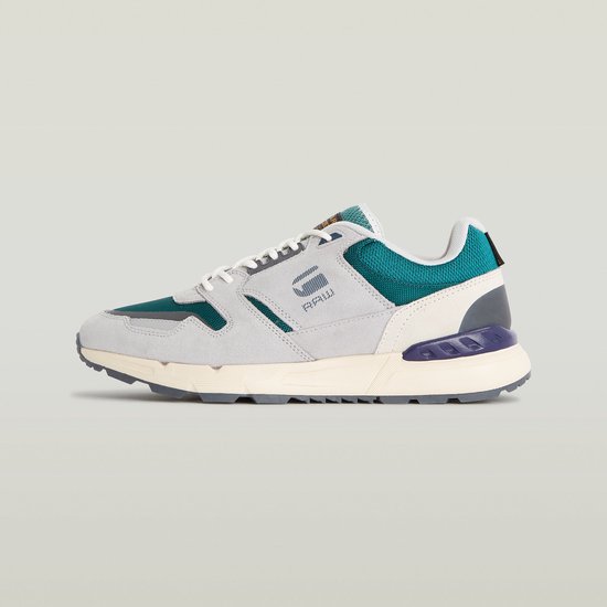 Lichtgrijze G-Star sneaker met teal-groene mesh en off-white zool. G-Star RAW logo op de zijkant.