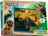 Puzzel Comedy Wildlife Vogel poept op hoofd Buffel 100 stukjes