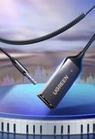 Zilverkleurige Ugreen Bluetooth adapter met 3.5mm jack.
