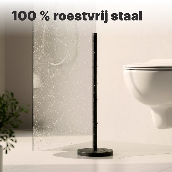 Zwarte, vrijstaande toiletrolhouder met ronde basis, in een badkamer.