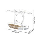 Transparant acryl vogelvoederhuisje gevuld met vogelzaad, met afmetingen van 30cm/11in breed, 20cm/7.7in hoog en 4cm/1.3in diep.