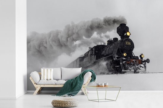 Behang - Fotobehang Stoomlocomotief in de sneeuw - liggend - Breedte 420 cm x hoogte 280 cm
