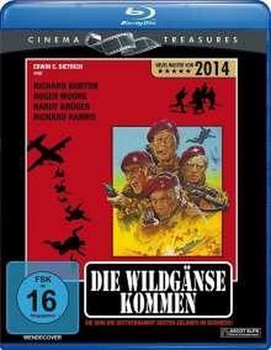 Blu-ray hoes van 'De Wilde Ganzen Komen', met vier mannen in rode baretten en legeruniformen. Toont militaire vliegtuigen en de tekst '2014'.