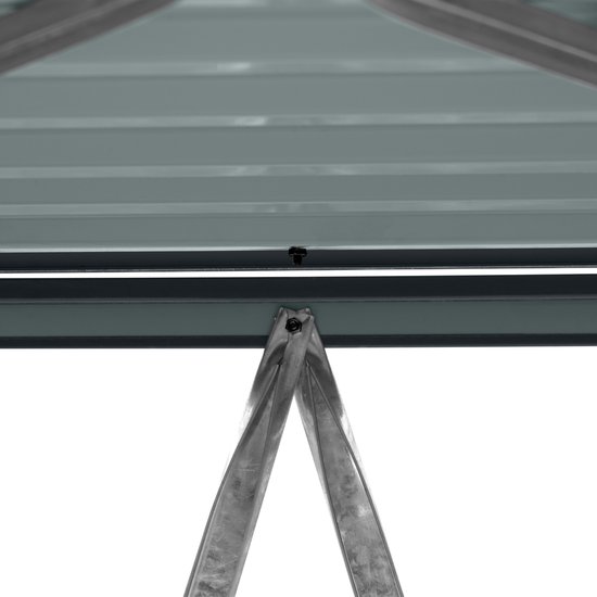 Detail van de metalen steunbalken aan de bovenzijde van de containerombouw.