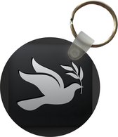 Sleutelhanger - Een illustratie van een duif op een zwarte achtergrond - Plastic - Rond - Uitdeelcadeautjes