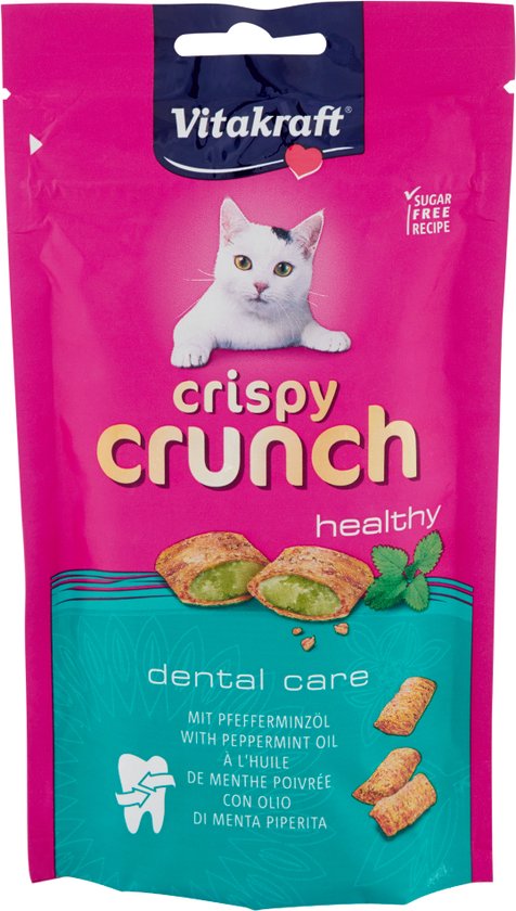 Roze verpakking van Vitakraft Crispy Crunch. Met witte kat, groene munten en 'dental care' tekst.