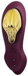 Vibrateur violet avec accent doré plié et logo Zalo.