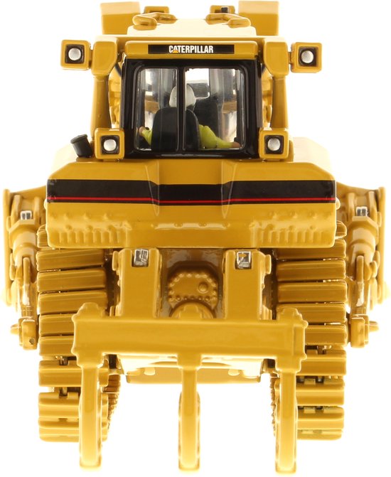 Gele Caterpillar D8R bulldozer met grijper aan de voorzijde, frontaal aanzicht.