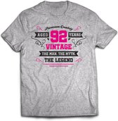 92 Jaar Legend - Feest kado T-Shirt Heren / Dames - Antraciet Grijs / Roze - Perfect Verjaardag Cadeau Shirt - grappige Spreuken, Zinnen en Teksten. Maat XL
