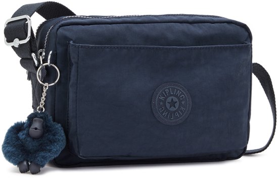 Donkerblauwe Kipling schoudertas van nylon met voorvak, ritssluiting en een donkerblauw aapje als sleutelhanger.