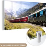 MuchoWow® Glasschilderij 40x20 cm - Schilderij acrylglas - Een rode trein in de bergen - Foto op glas - Schilderijen