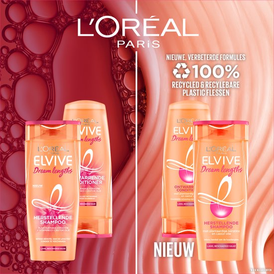 Twee paar oranje L'Oréal Elvive Dream Lengths shampoo- en conditionerflessen op een roze achtergrond met bubbels.