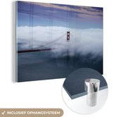 MuchoWow® Glasschilderij 120x80 cm - Schilderij acrylglas - Golden gate bridge getroffen door wolkgordijn - Foto op glas - Schilderijen
