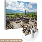 MuchoWow® Glasschilderij 150x100 cm - Schilderij acrylglas - Witte wolken boven de Borobudur tempel - Foto op glas - Schilderijen