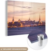 MuchoWow® Glasschilderij 180x120 cm - Schilderij acrylglas - Prachtige zonsondergang boven het Stadshart van Tallinn - Foto op glas - Schilderijen