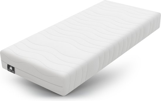 Witte matras met golvend gestikt patroon en een klein zwart logo aan de zijkant.