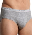 Grijze midi slip van Sloggi, gedragen door een man, met grijze elastische tailleband met logo.
