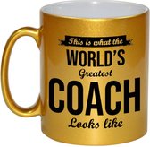 This is what the worlds greatest coach looks like cadeau koffiemok / theebeker - 330 ml - goudkleurig - begeleider - verjaardag / bedankje / cadeau - tekst mokken