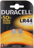 Duracell LR44 batterijen, 1.5V, in verpakking met oranje en geel gloeiend patroon.