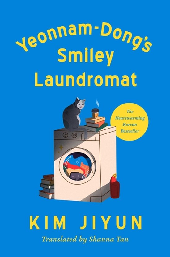 Boek 'Yeonnam-Dong's Smiley Laundromat' met op de voorkant een wasmachine met een kat erop en boeken ernaast.