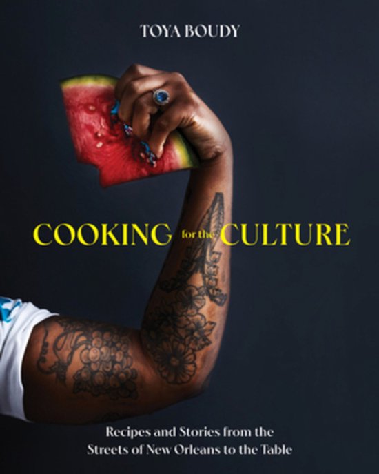 Couverture du livre 'Cooking for the Culture' avec un bras tatoué tenant une tranche de pastèque. Titre en haut : TOYA BOUDY.