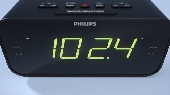 Zwarte Philips wekkerradio met groene digitale cijfers en FM-indicator.