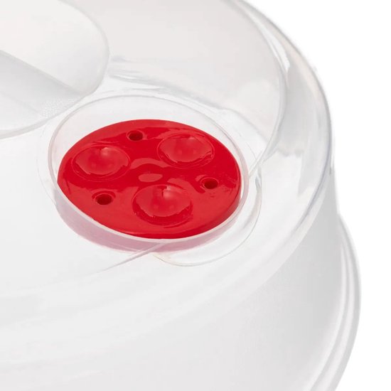 Close-up van de rode ventielknop op een transparant magnetrondeksel.